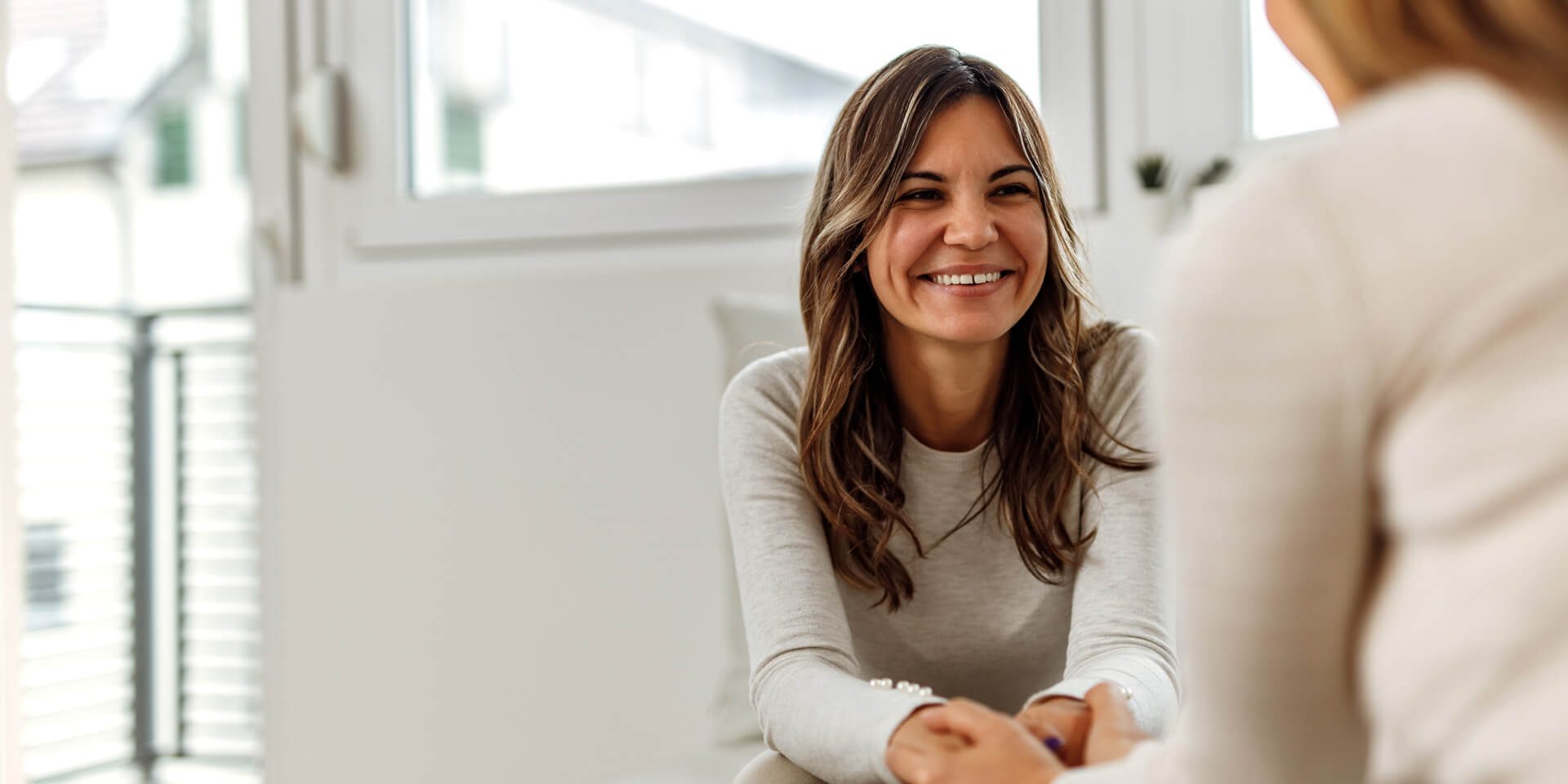 AdobeStock_405197785 Middle-aged woman eagerly speaking with counselor